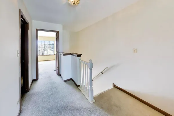 a bathroom with a tub shower and sink