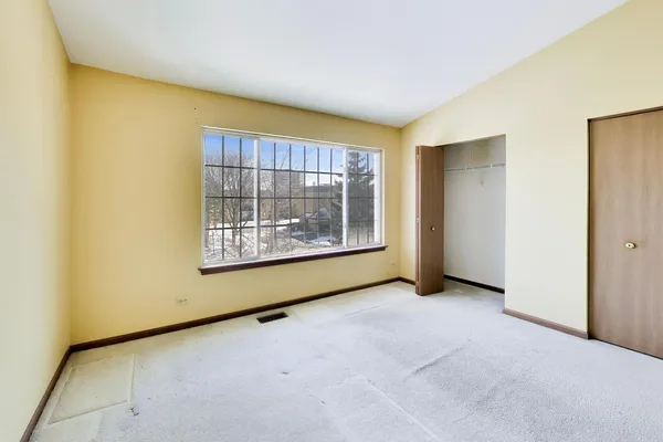 a view of a room with window and stairs