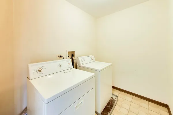 a view of a house with snow on the road