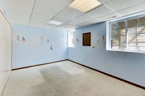 a view of a storage & utility room with a window