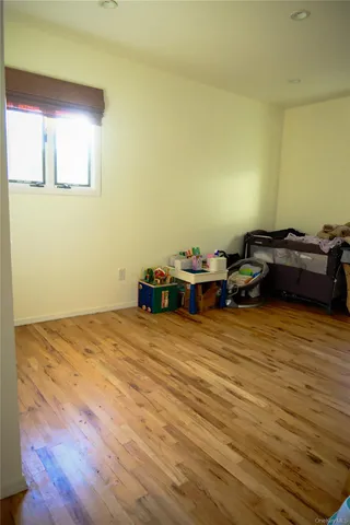 a living room with furniture pool table and a fireplace
