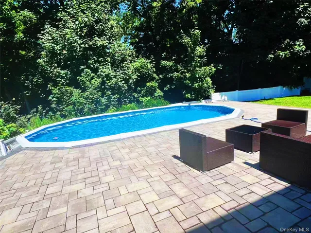 a view of yard with large trees