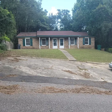 a view of front a house with a yard