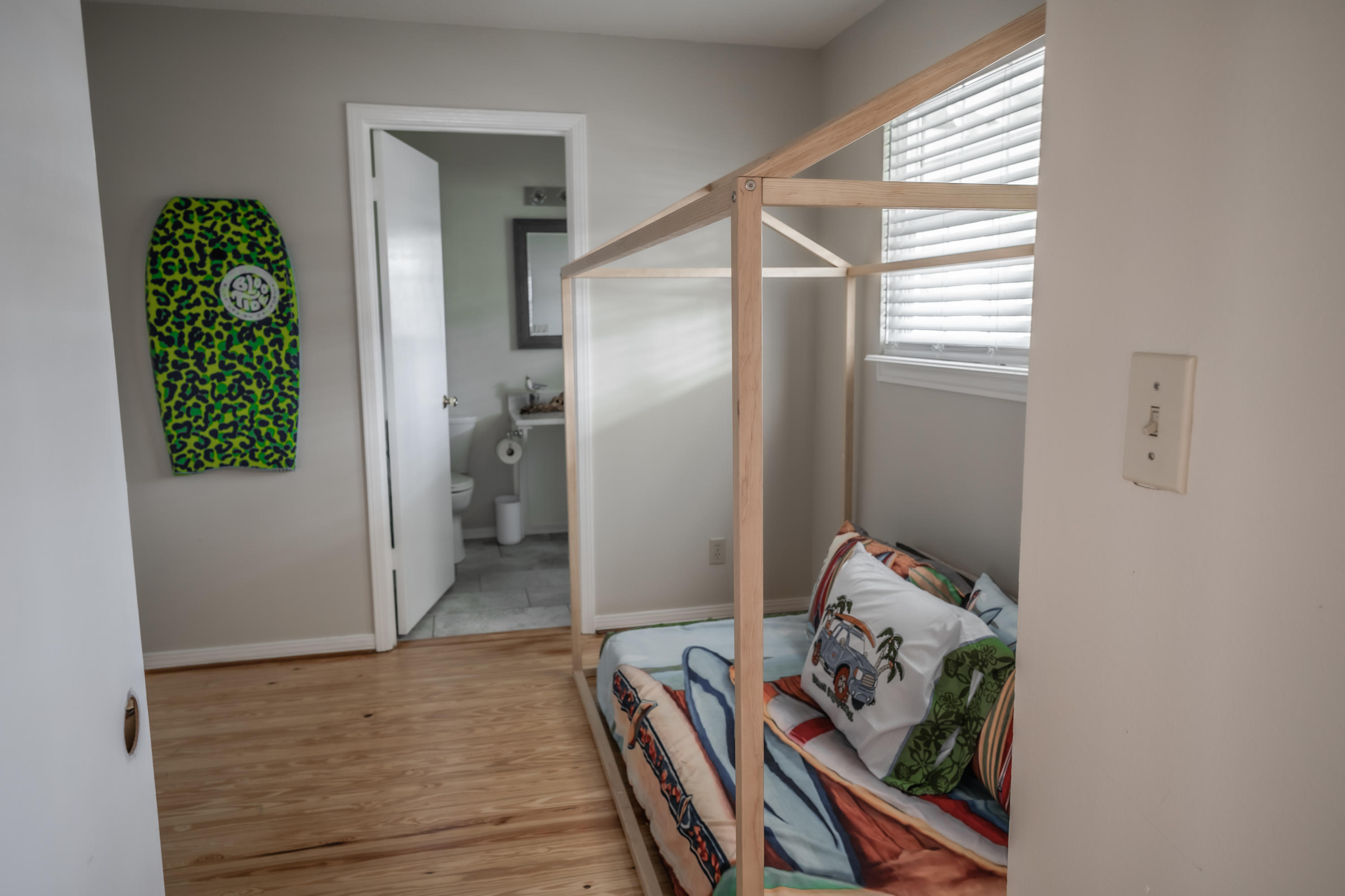 8103 East County Highway 30A Inlet Beach, FL 32461 - Photo 16 of 46 a hallway with white walls and wooden floor