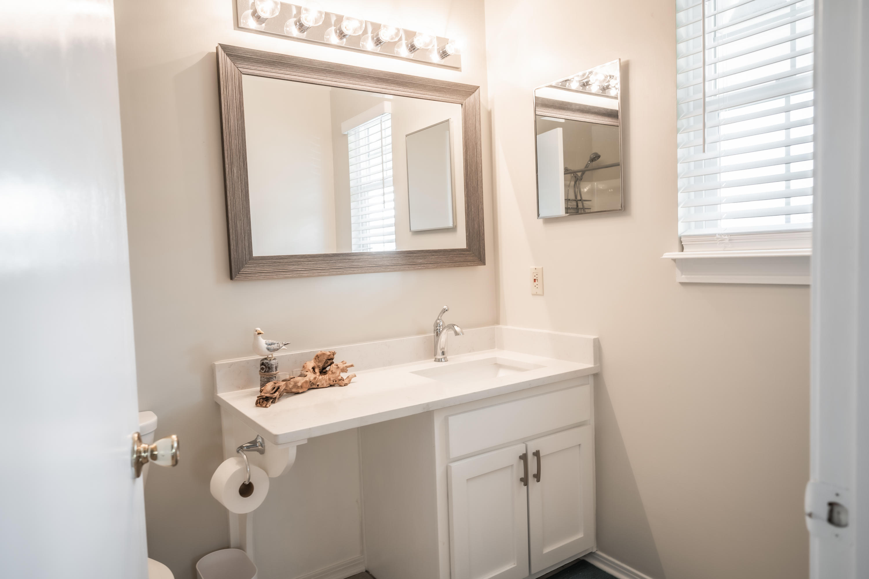 8103 East County Highway 30A Inlet Beach, FL 32461 - Photo 17 of 46 a bathroom with a sink and a mirror