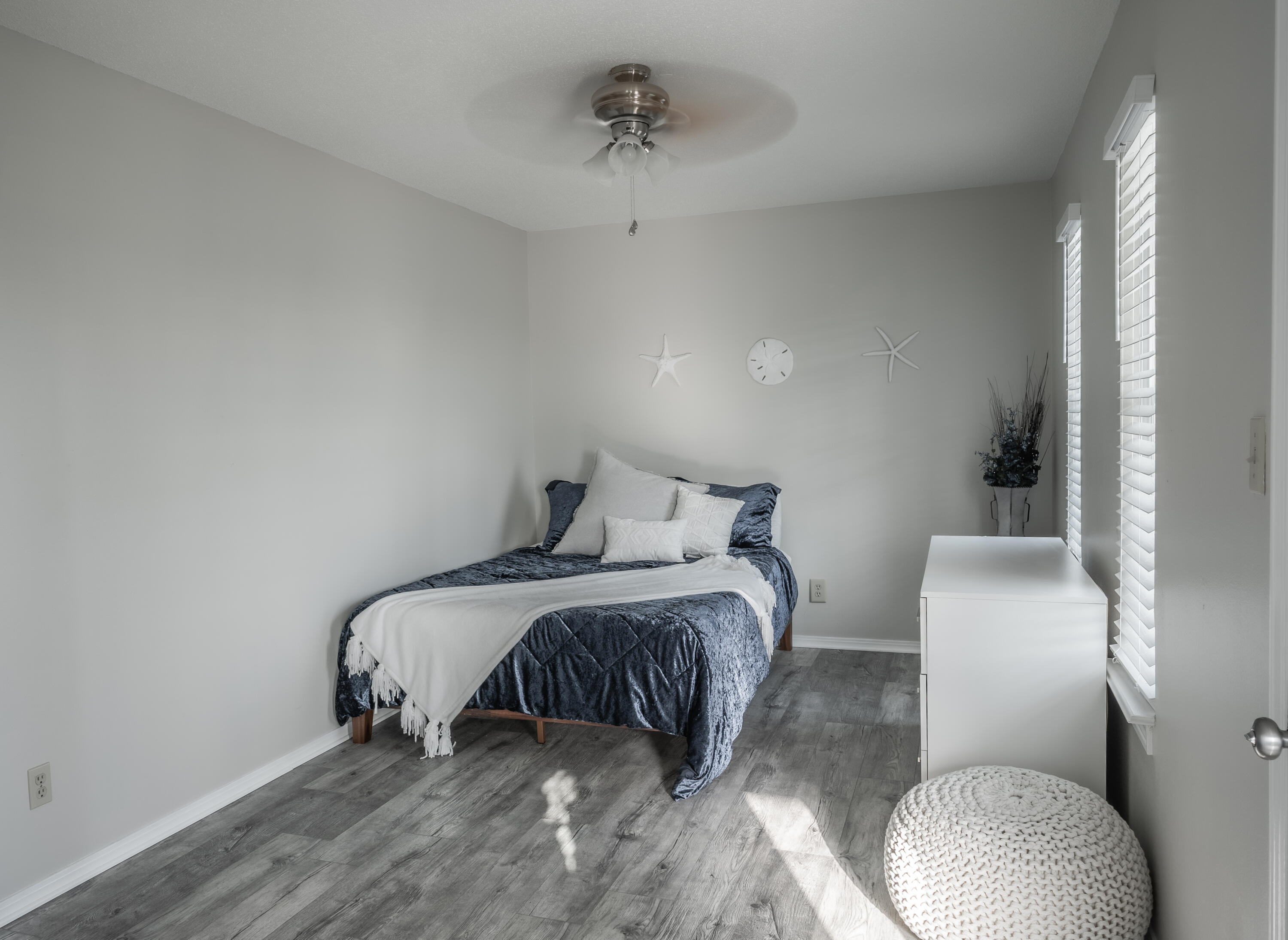 8103 East County Highway 30A Inlet Beach, FL 32461 - Photo 24 of 46 a bedroom with a bed and a chair