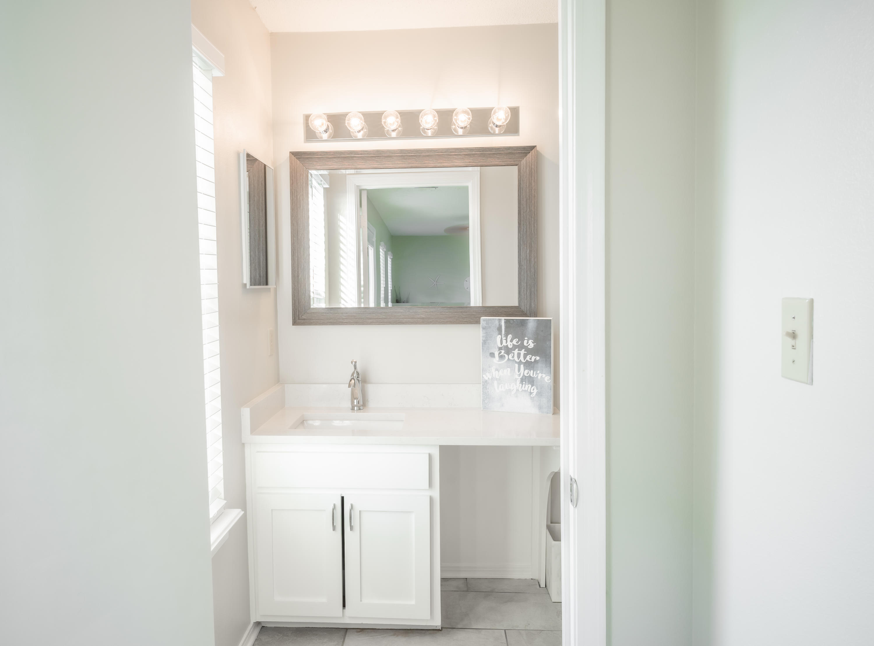 8103 East County Highway 30A Inlet Beach, FL 32461 - Photo 32 of 46 a bathroom with a sink and a mirror