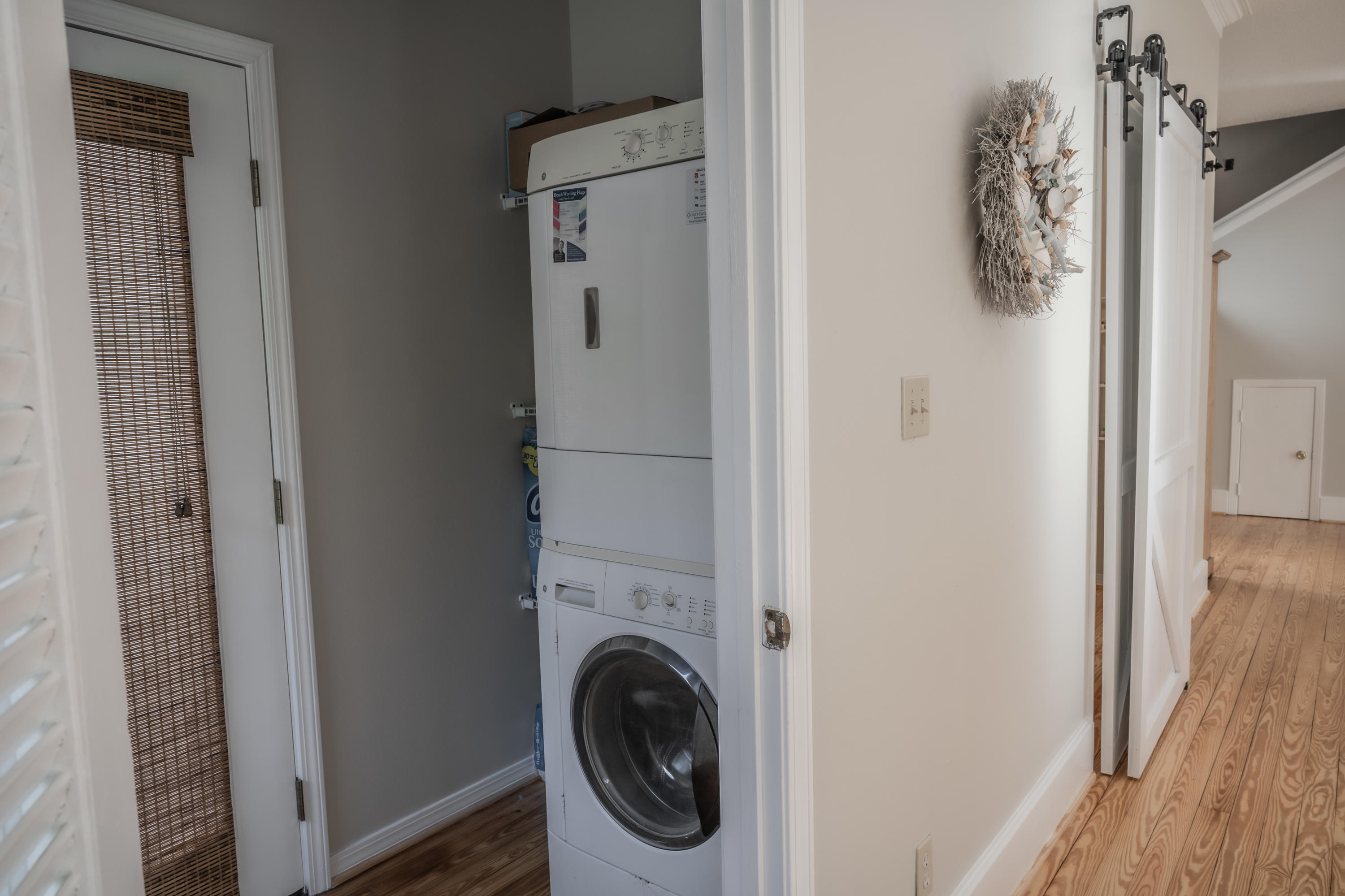 8103 East County Highway 30A Inlet Beach, FL 32461 - Photo 36 of 46 a view of a hallway with washer and dryer
