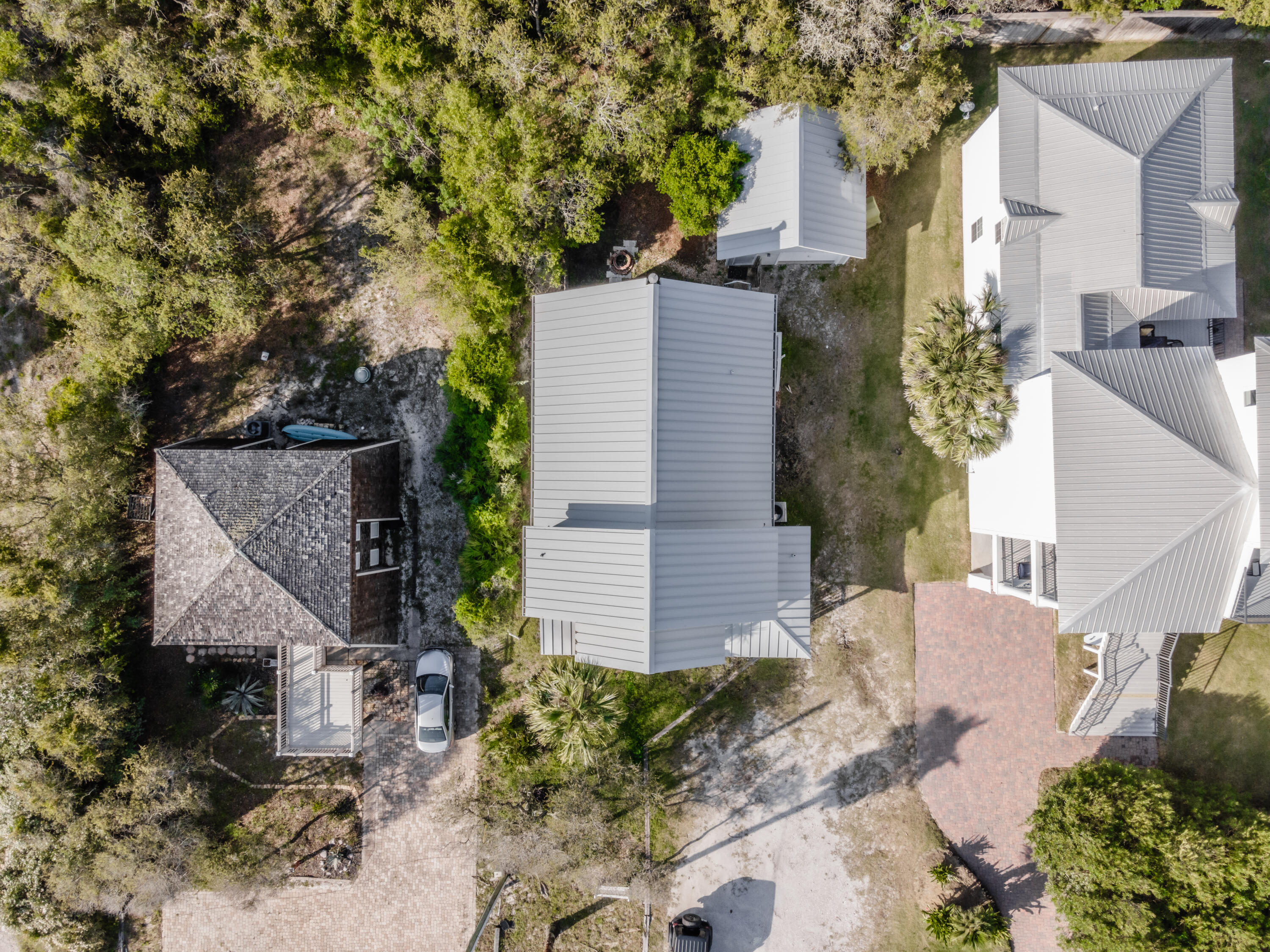8103 East County Highway 30A Inlet Beach, FL 32461 - Photo 46 of 46 a aerial view of a house with a yard and large trees