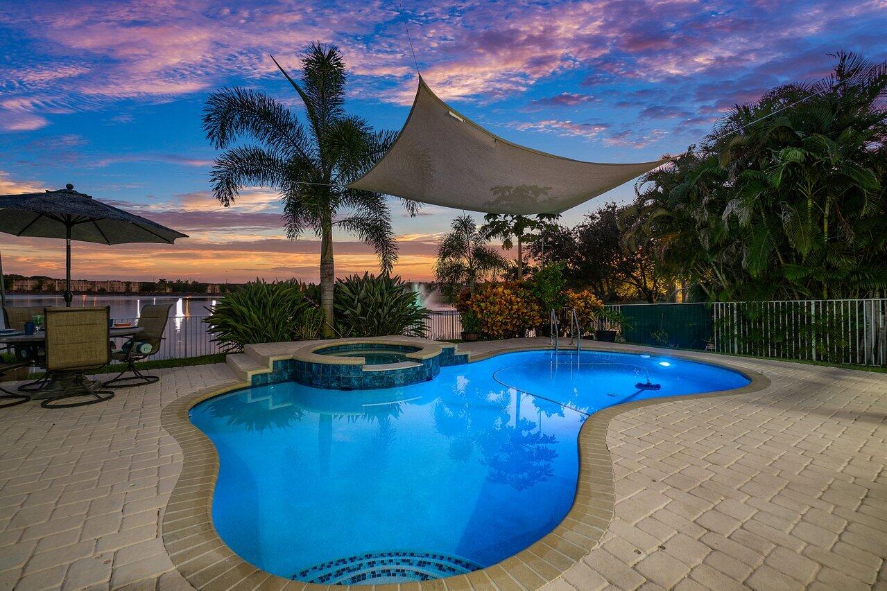 10290 Northwest 60th Place Parkland, FL 33076 - Photo 12 of 36 a view of a swimming pool with a patio