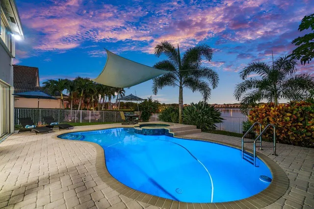 a view of a swimming pool with an outdoor seating