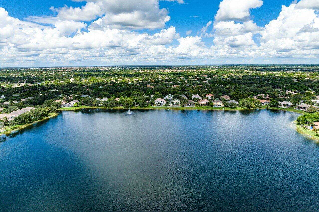 10290 Northwest 60th Place Parkland, FL 33076 - Photo 15 of 36 a view of a lake with houses in the back