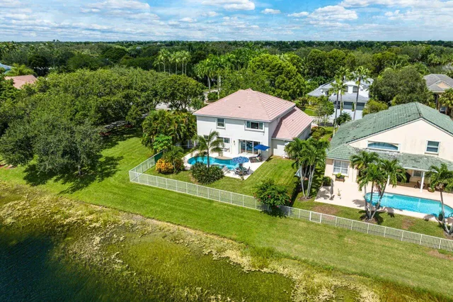 a view of a garden with a house