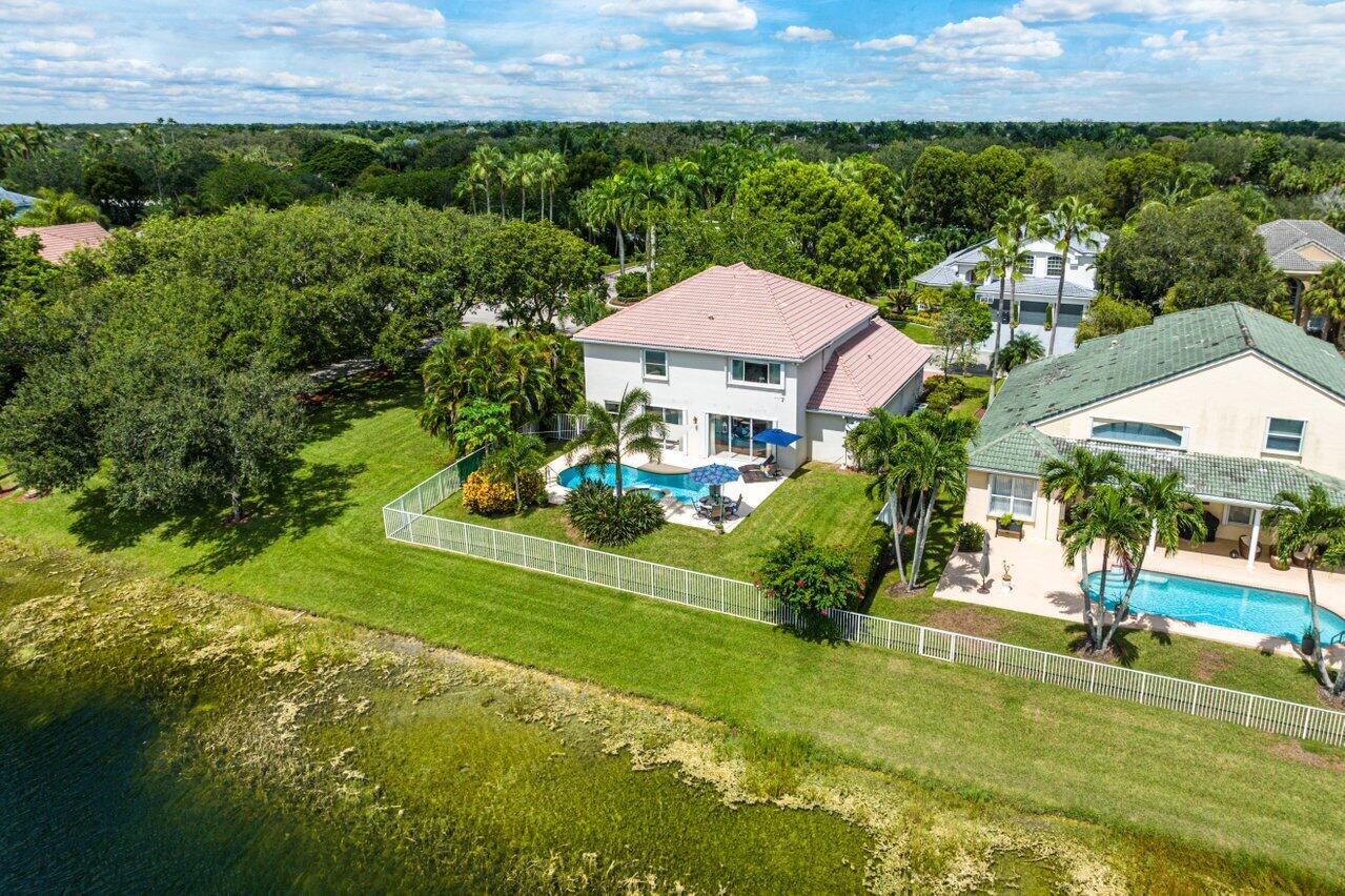 10290 Northwest 60th Place Parkland, FL 33076 - Photo 21 of 36 a view of a garden with a house