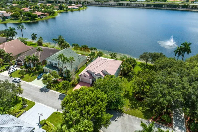 an aerial view of a house with a lake view