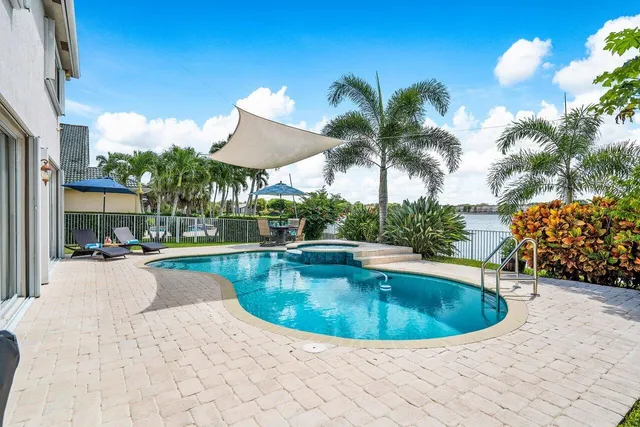 a view of a swimming pool with a lounge chair