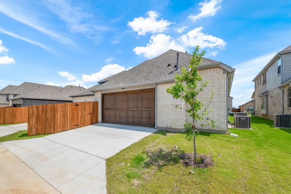 9337 Loggerhead Way Fort Worth, TX 76118 - Photo 39 of 40 a swimming pool with yard in front of it