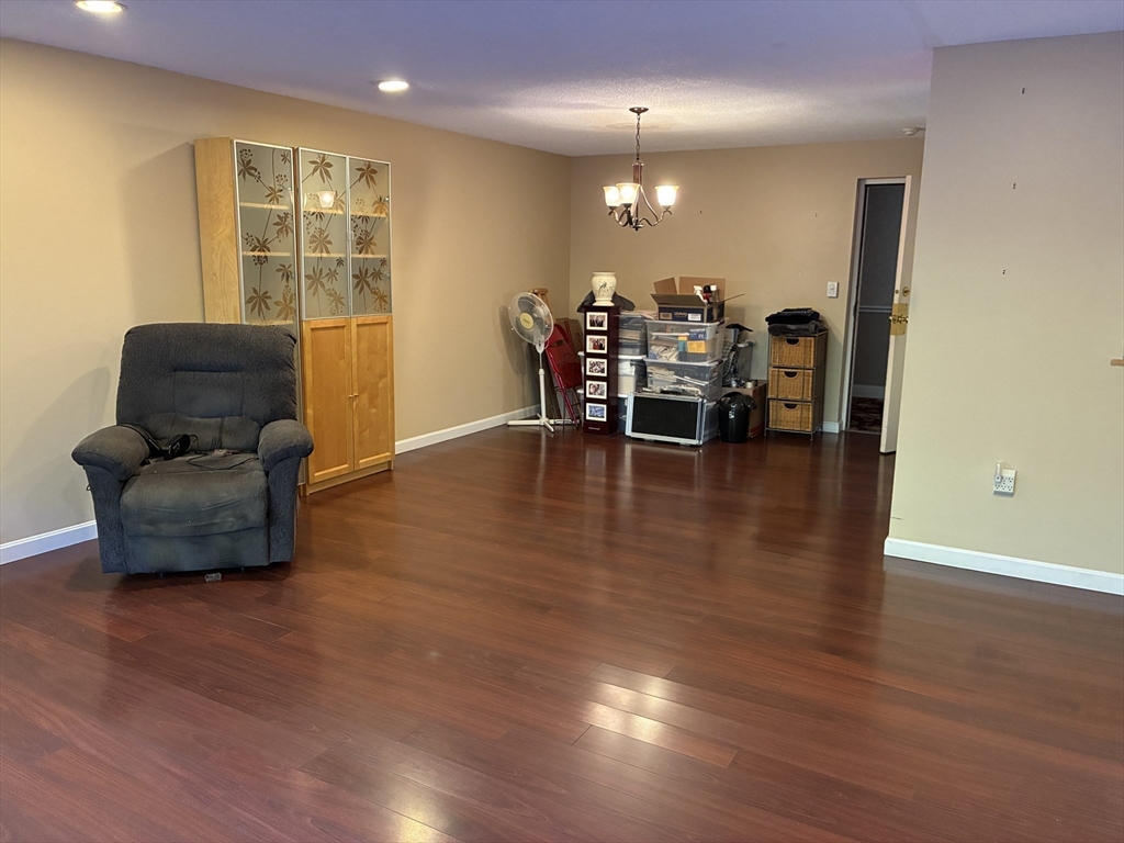 2 Summit Drive, Unit 18 Wakefield, MA 01880 - Photo 7 of 11 a living room with furniture and wooden floor
