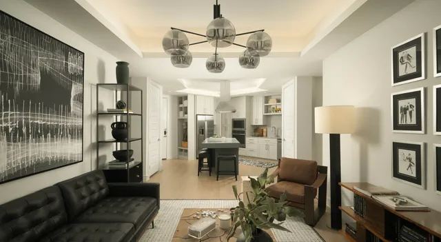 a kitchen with counter space a sink and living room view