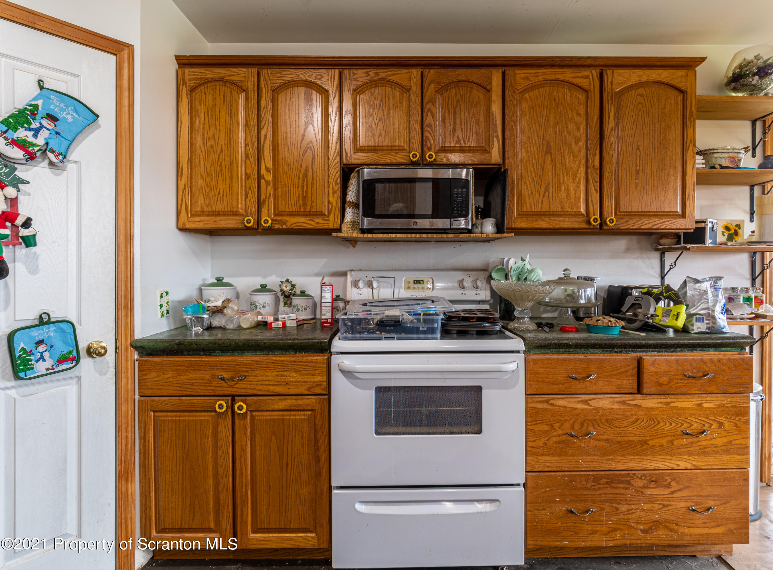 172 Potter Road Kingsley, PA 18826 - Photo 17 of 56 a kitchen with stainless steel appliances granite countertop a refrigerator and stove top oven
