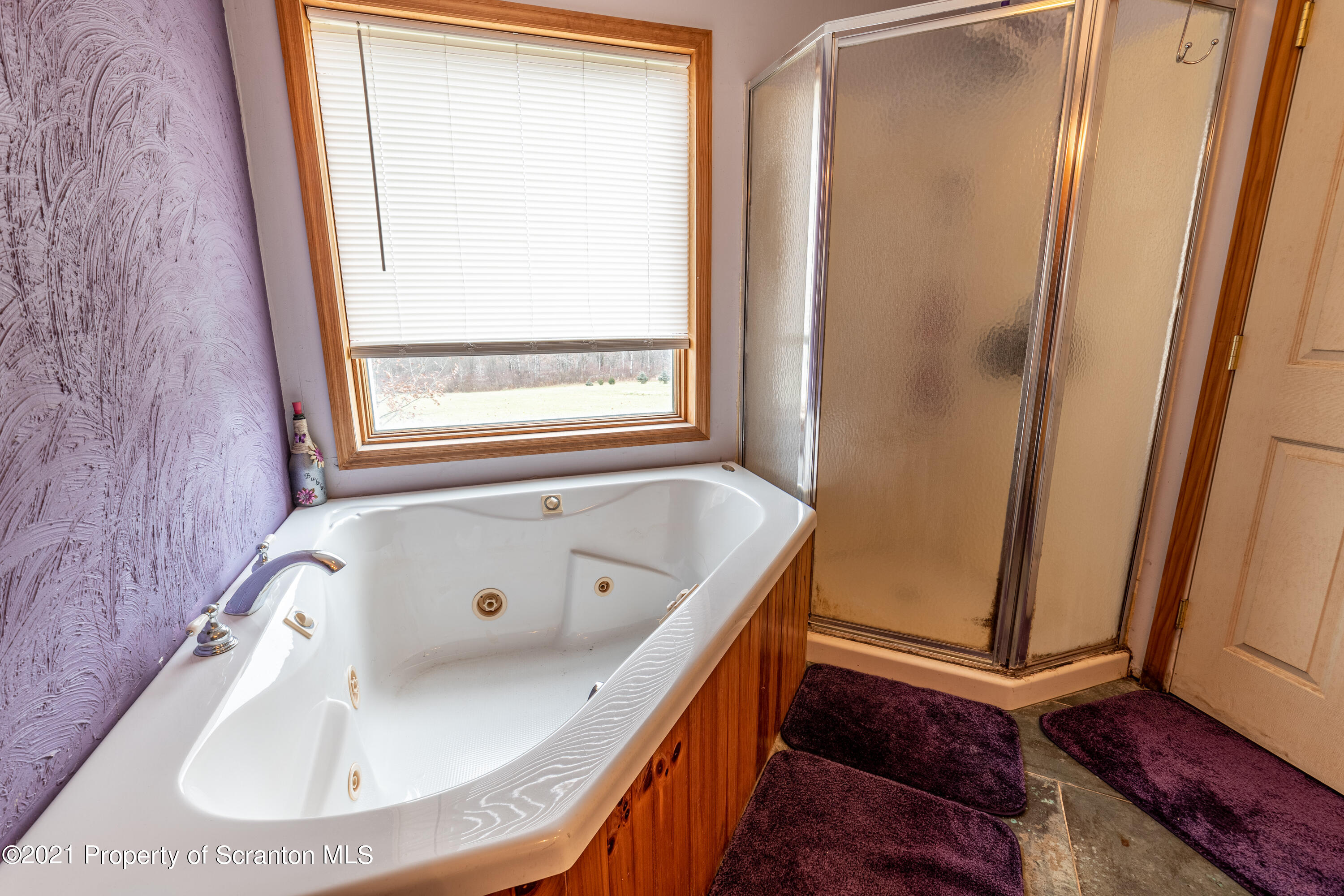172 Potter Road Kingsley, PA 18826 - Photo 26 of 56 a bathroom with a tub and a sink