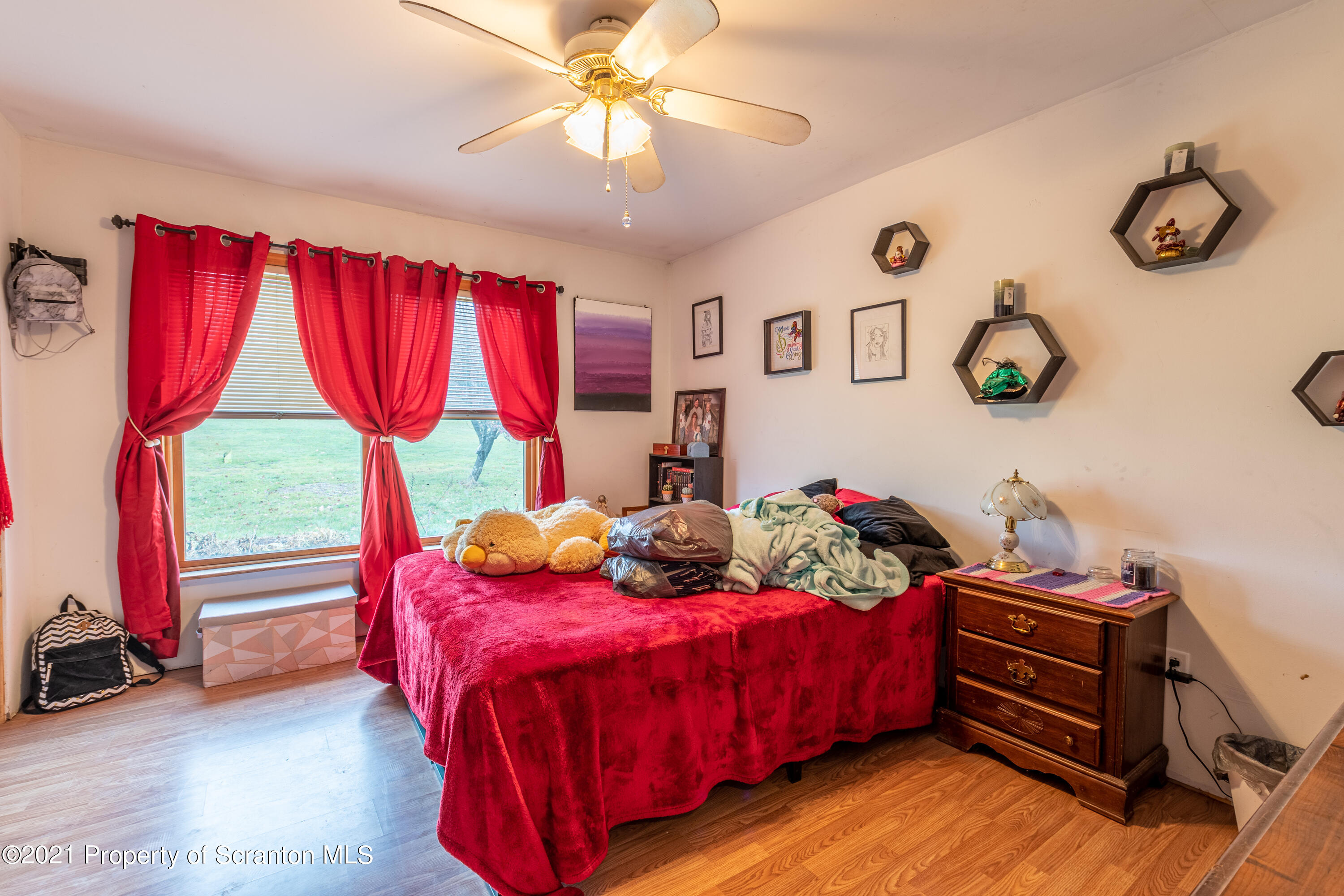 172 Potter Road Kingsley, PA 18826 - Photo 33 of 56 a bedroom with a bed and a window