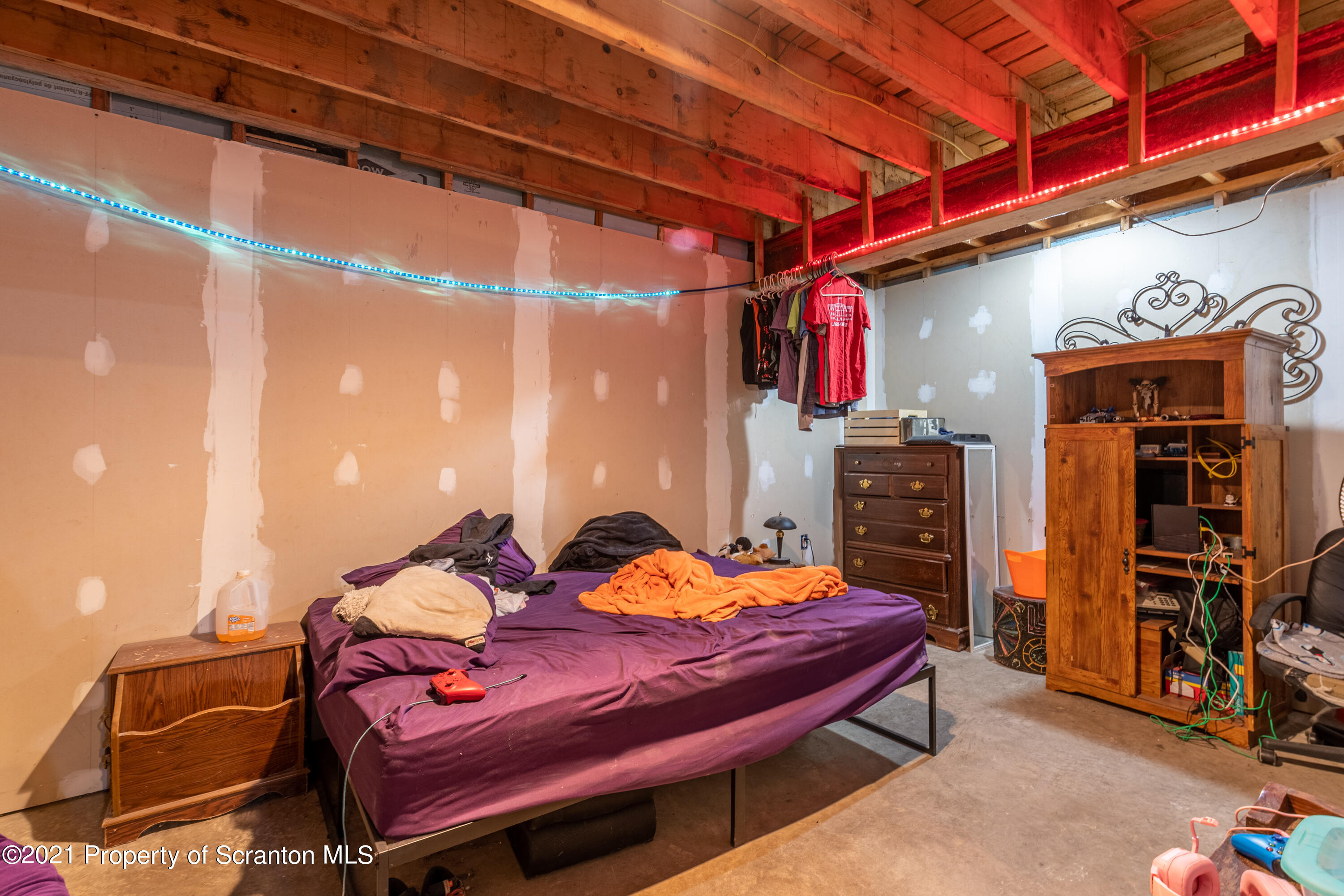 172 Potter Road Kingsley, PA 18826 - Photo 47 of 56 a bed room with a bed and a chair