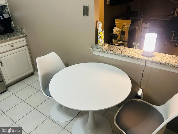 a bathroom with a toilet mirror and vanity