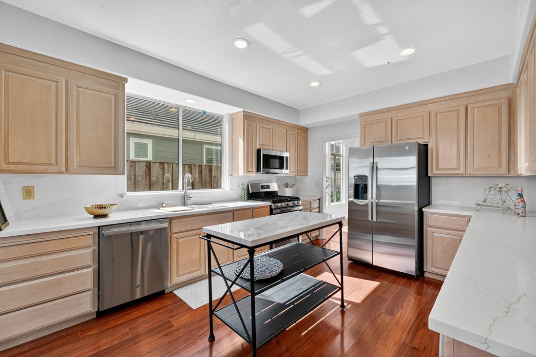 17671 Riverbend Road Salinas, CA 93908 - Photo 12 of 48 a kitchen with a sink a counter top space stainless steel appliances and cabinets