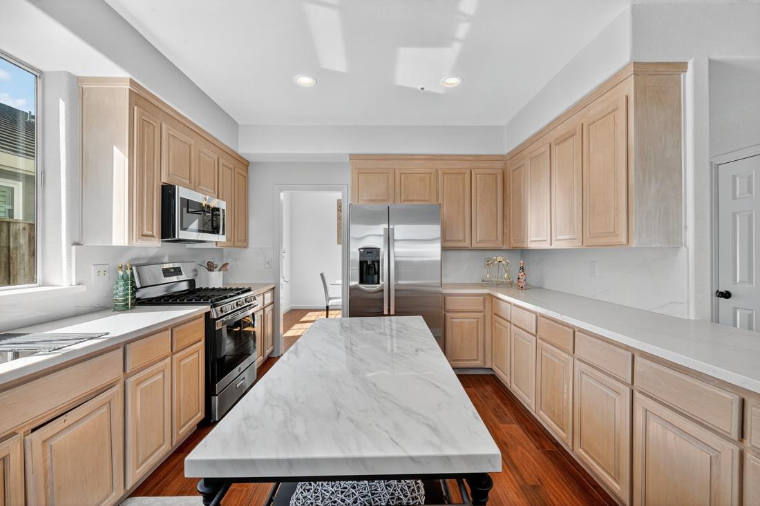 17671 Riverbend Road Salinas, CA 93908 - Photo 13 of 48 a kitchen with granite countertop a stove top oven sink and cabinets