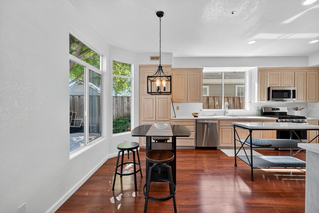 17671 Riverbend Road Salinas, CA 93908 - Photo 15 of 48 a view of a dining room with furniture window and wooden floor