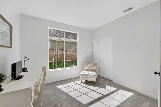 a view of a livingroom with furniture and window