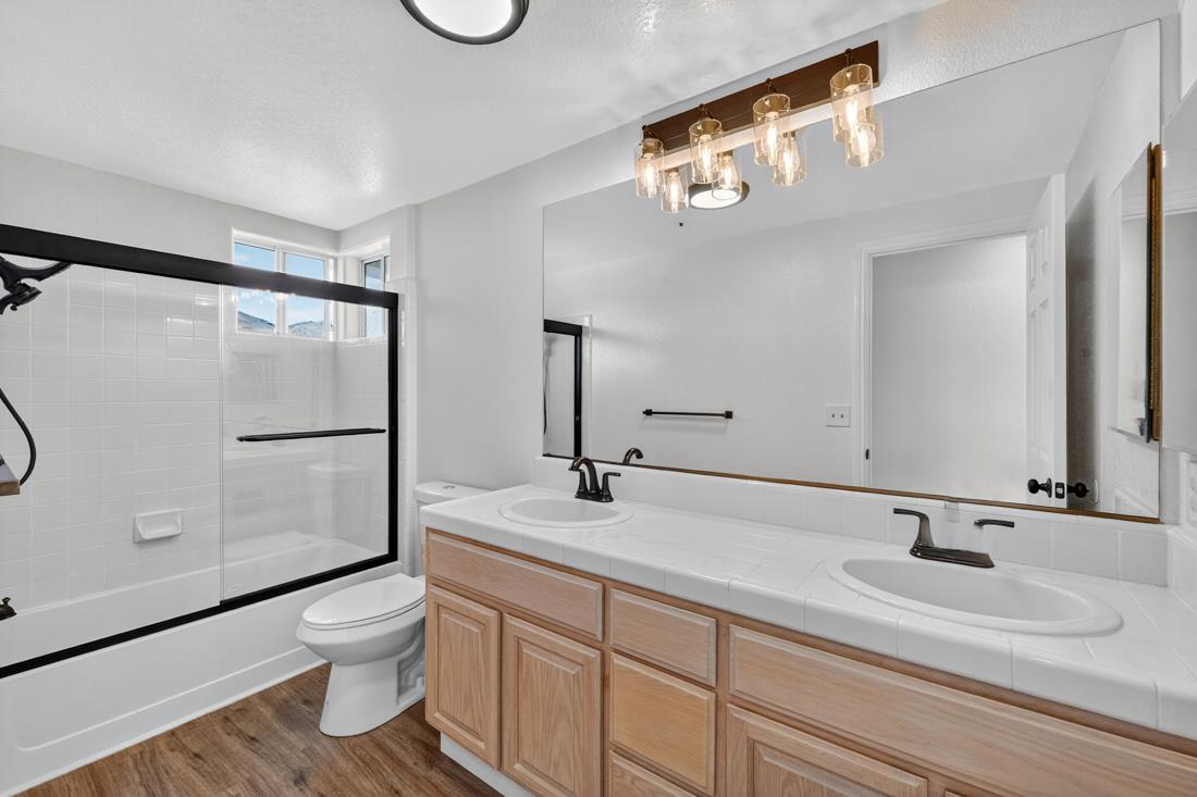 17671 Riverbend Road Salinas, CA 93908 - Photo 26 of 48 a bathroom with a double vanity sink mirror and toilet