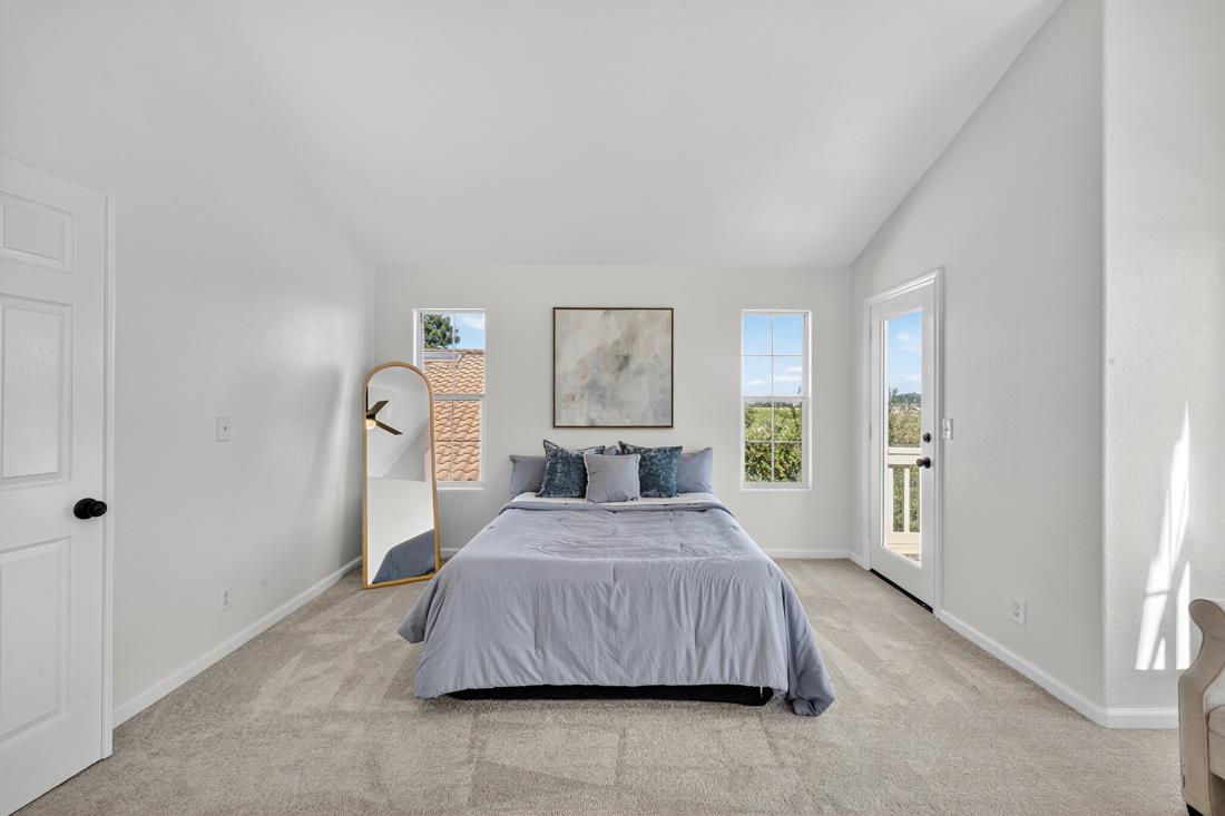 17671 Riverbend Road Salinas, CA 93908 - Photo 32 of 48 a bedroom with a bed and a painting on the wall