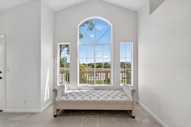 a bathroom with a granite countertop tub sink and mirror