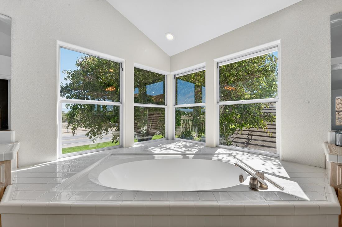 17671 Riverbend Road Salinas, CA 93908 - Photo 39 of 48 a room with a large window and a potted plant