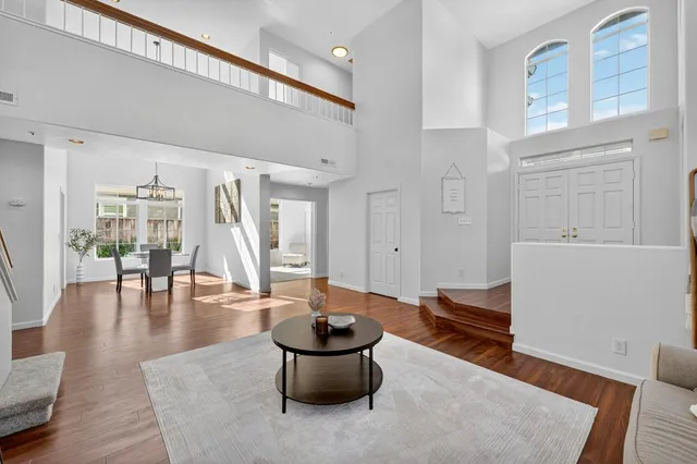 a view of a dining room with furniture window and wooden floor