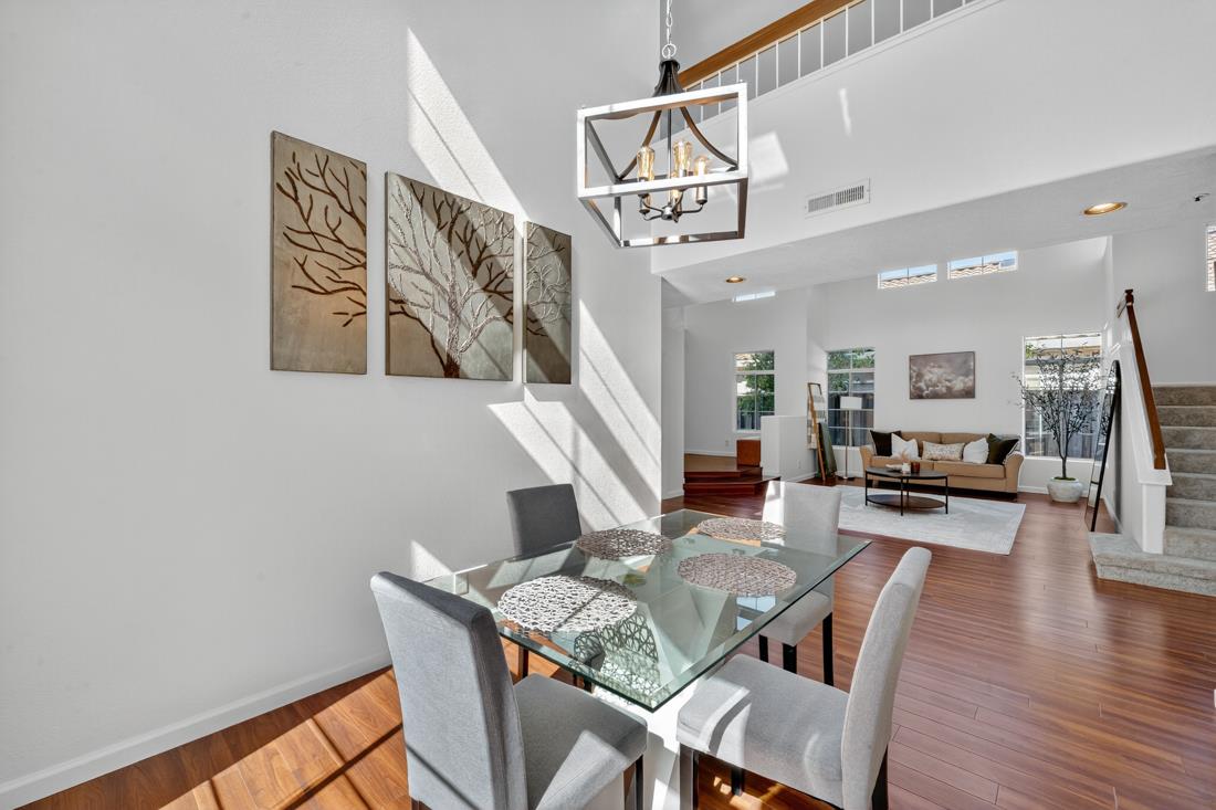 17671 Riverbend Road Salinas, CA 93908 - Photo 10 of 48 a view of a dining room with furniture wooden floor and a chandelier