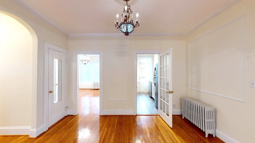 311 Tappan Street, Unit 3 Brookline, MA 02445 - Photo 9 of 35 a view of a room with wooden floor and stairs