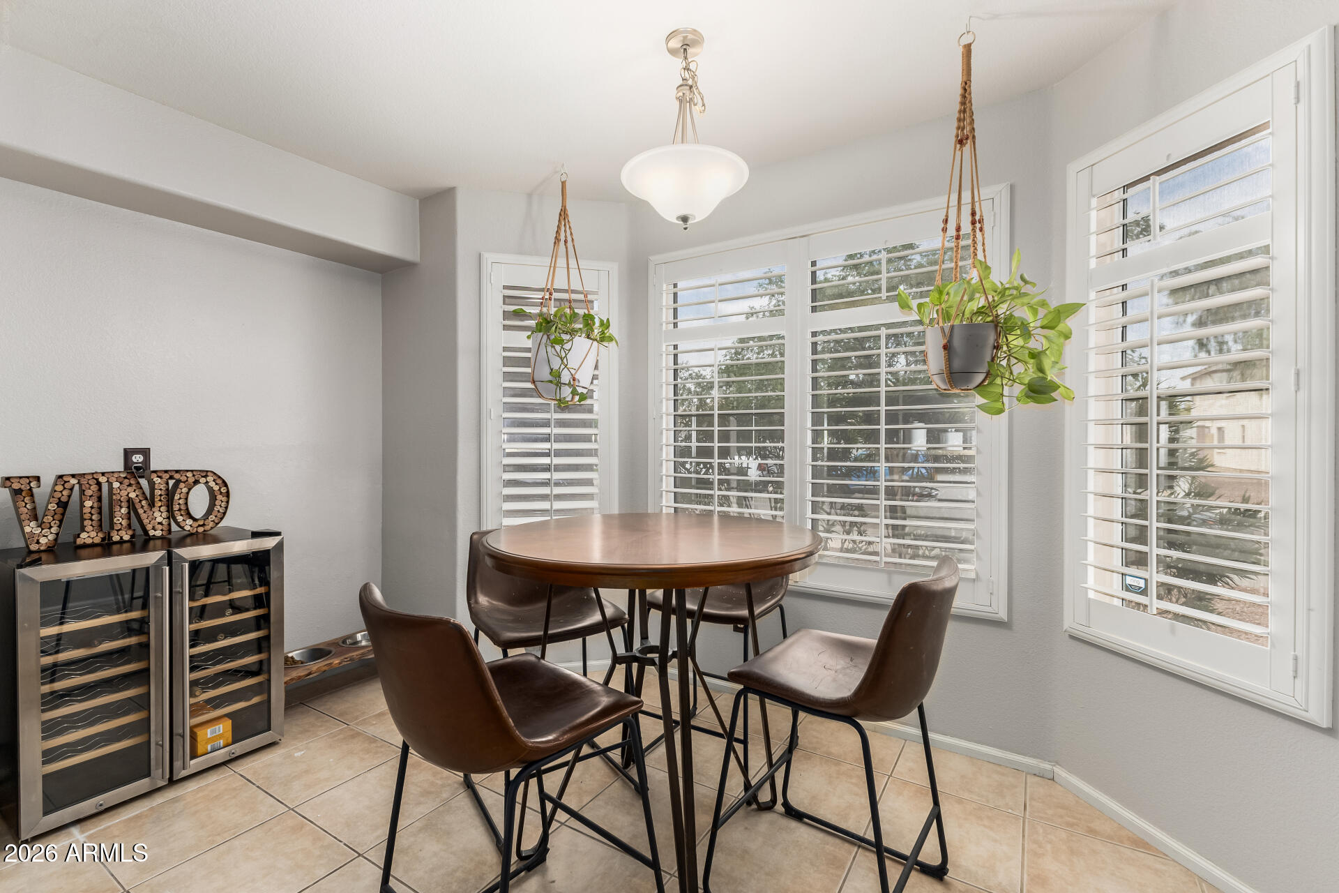 15587 West Rio Vista Lane Goodyear, AZ 85338 - Photo 16 of 36 a dining room with furniture and window