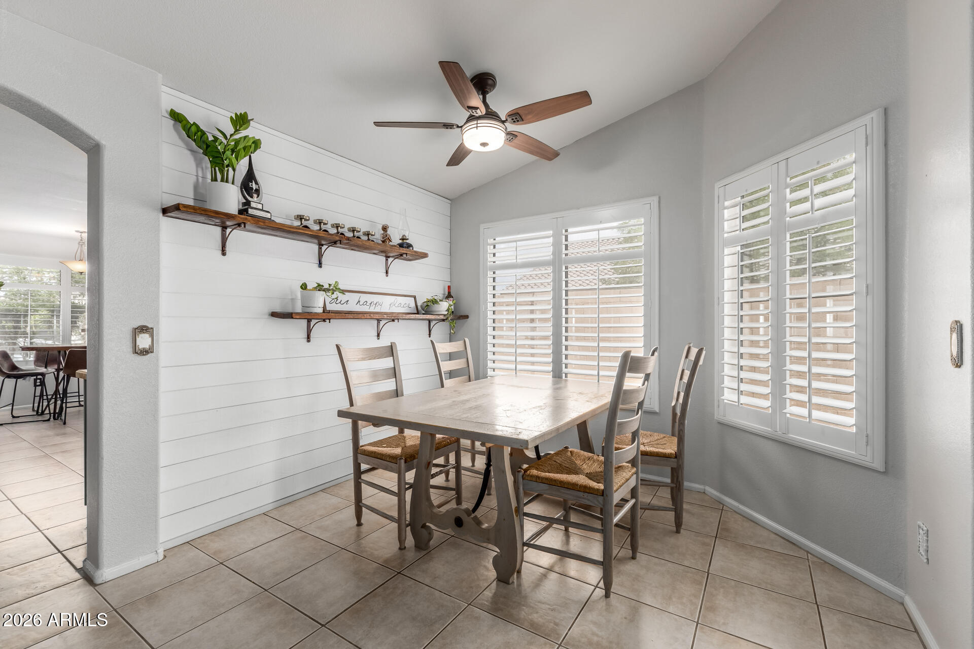 15587 West Rio Vista Lane Goodyear, AZ 85338 - Photo 17 of 36 a view of a dining room with furniture and a window