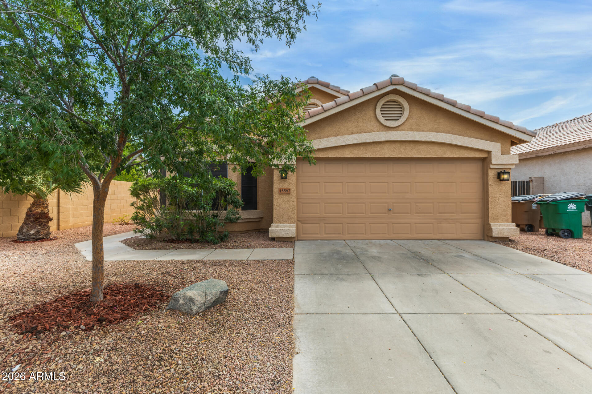 15587 West Rio Vista Lane Goodyear, AZ 85338 - Photo 2 of 36 a view of a garage door