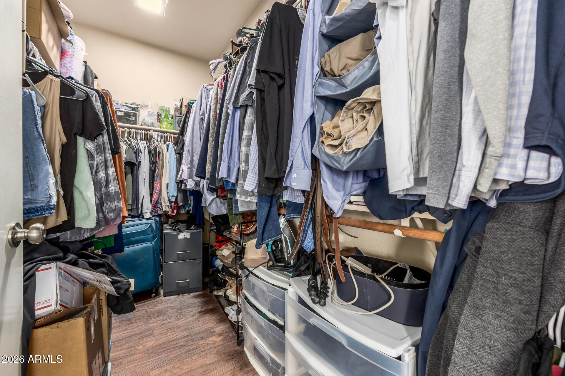 15587 West Rio Vista Lane Goodyear, AZ 85338 - Photo 23 of 36 a view of walk in closet with clothes