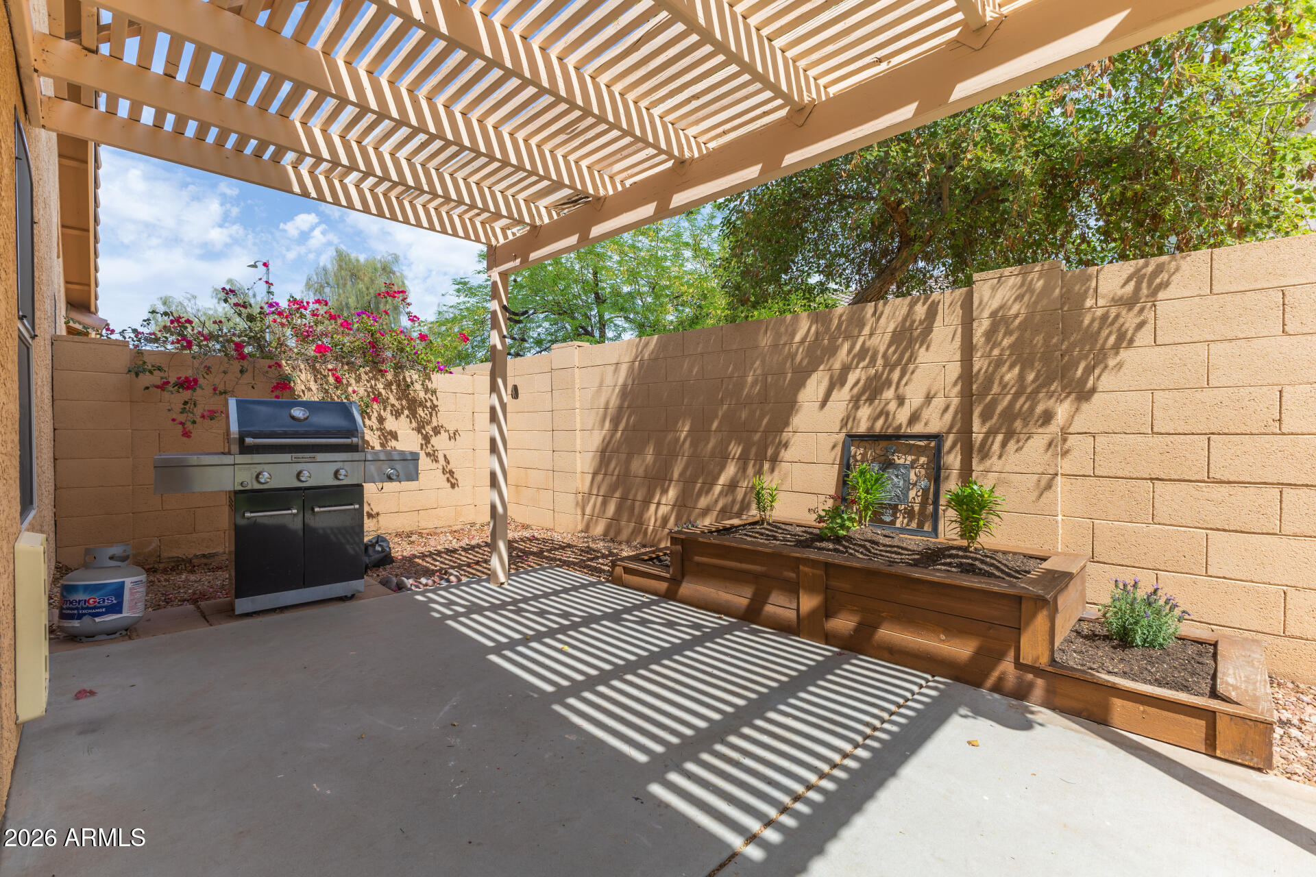 15587 West Rio Vista Lane Goodyear, AZ 85338 - Photo 30 of 36 a view of a backyard with sitting area