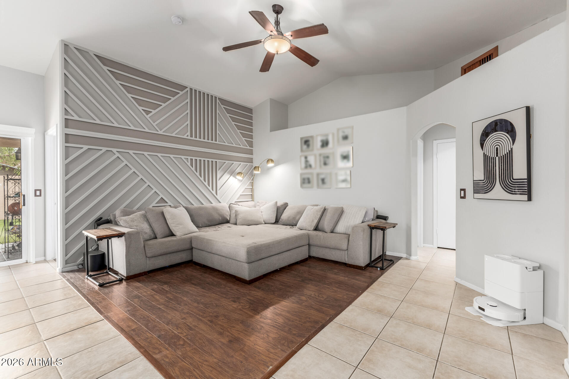 15587 West Rio Vista Lane Goodyear, AZ 85338 - Photo 3 of 36 a living room with furniture and a window