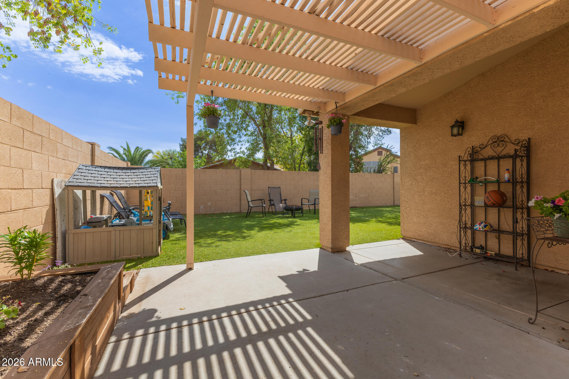 15587 West Rio Vista Lane Goodyear, AZ 85338 - Photo 31 of 36 a view of a backyard with a garden