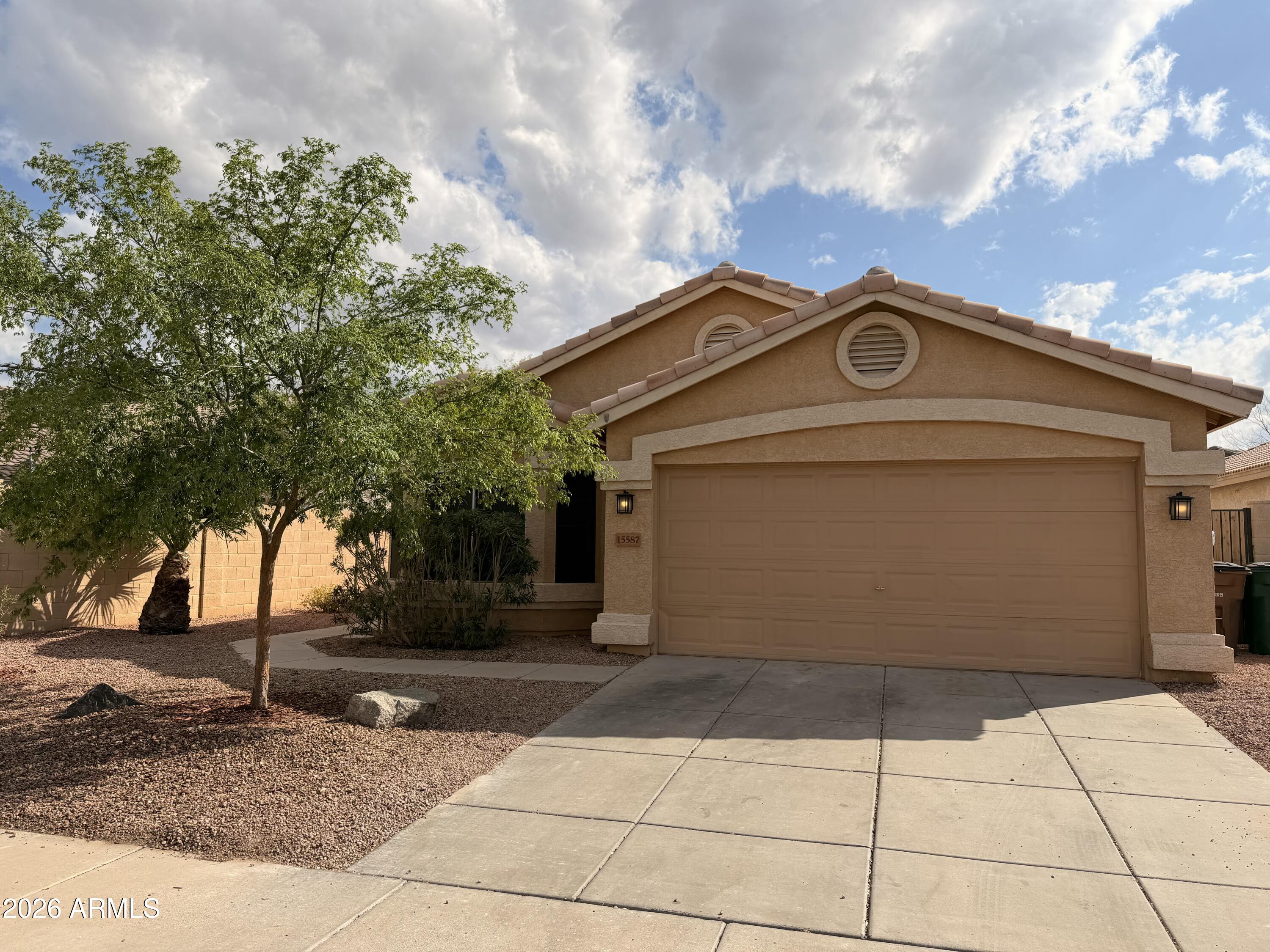 15587 West Rio Vista Lane Goodyear, AZ 85338 - Photo 35 of 36 a view of a house with a yard