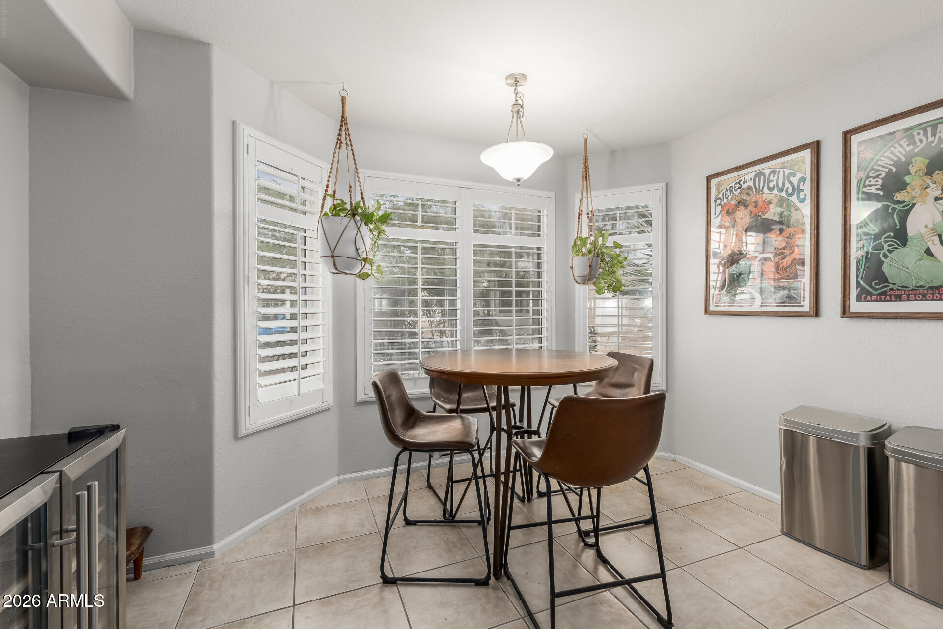 15587 West Rio Vista Lane Goodyear, AZ 85338 - Photo 5 of 36 a view of a dining room with furniture and window