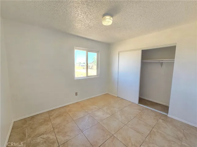 a bathroom with a toilet a sink a mirror a bathtub and vanity
