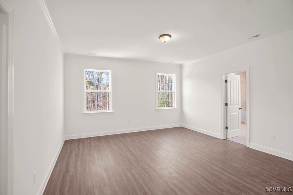 9254 Moldova Road Chesterfield, VA 23832 - Photo 29 of 49 an empty room with wooden floor and windows